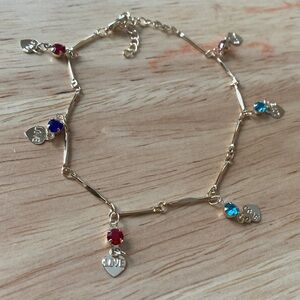 Pretty Bird Gold Bracelet with Red, Purple and Blue Charms